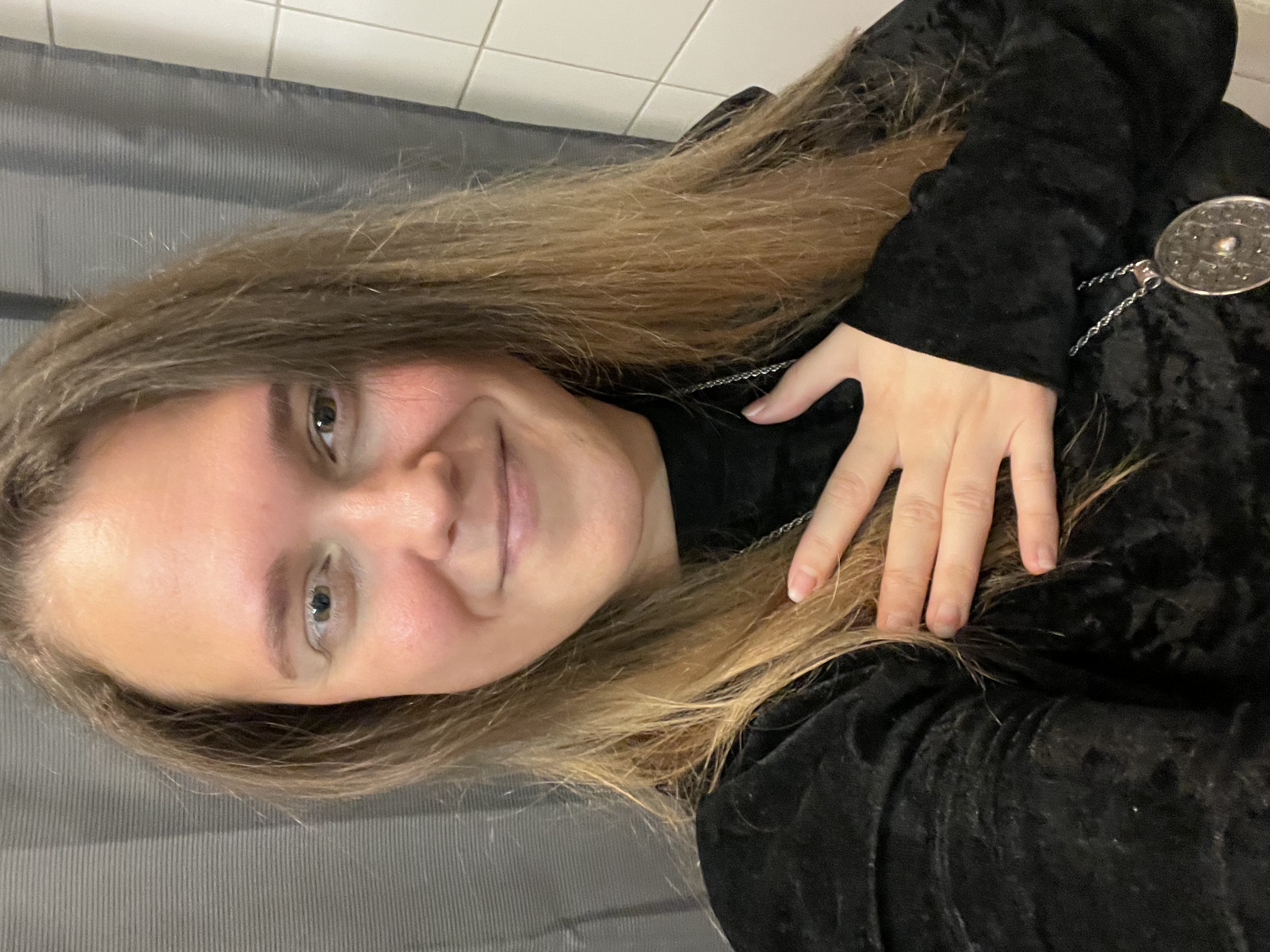 grayscale photo of woman in crew neck t-shirt raising her hands